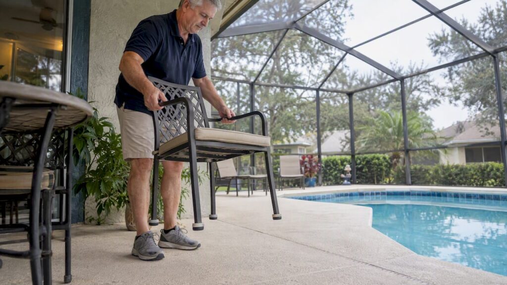 Homeowner lifts chair with protective leg pads